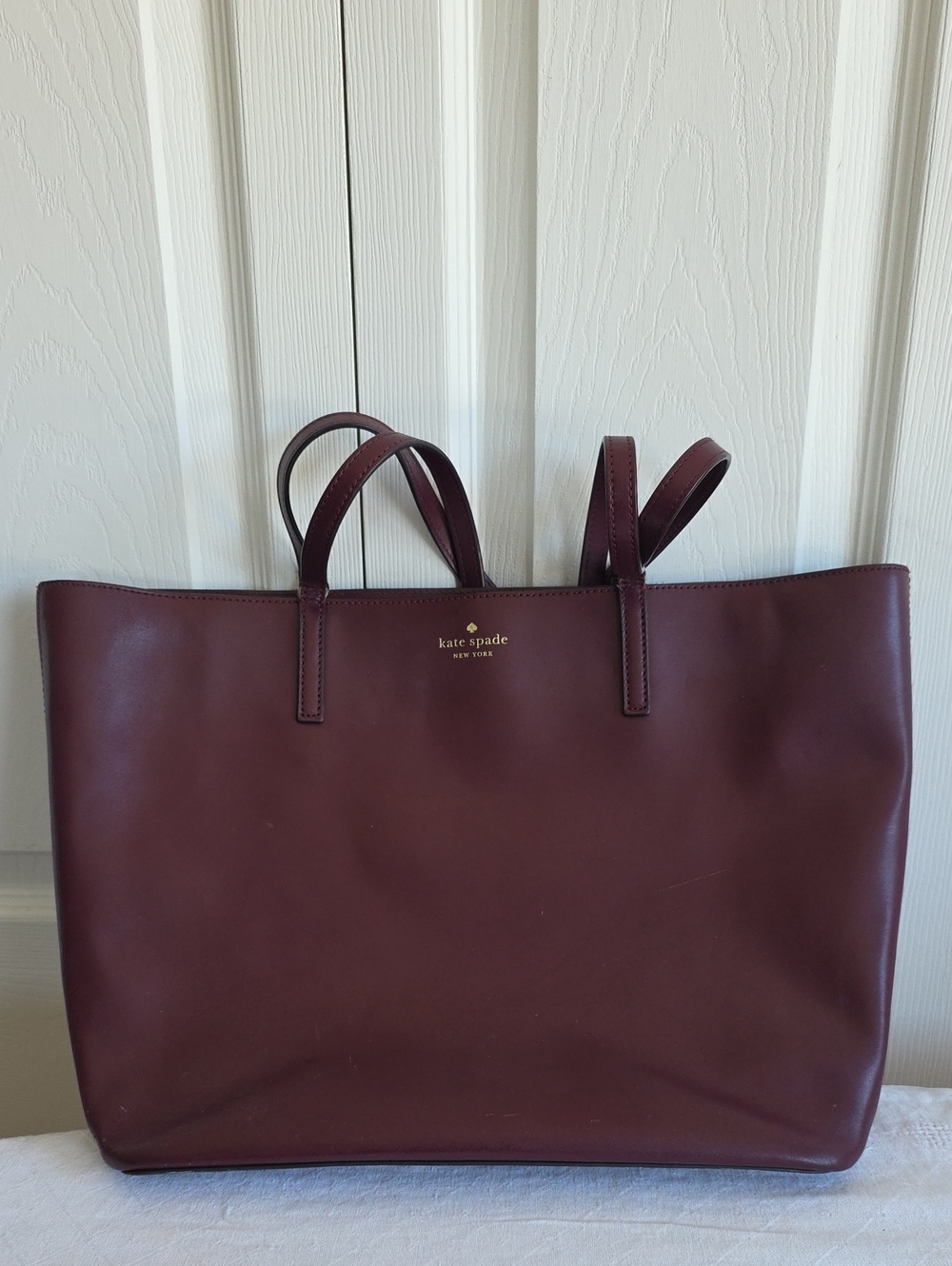 kate spade Burgundy Leather Tote with Gold Logo With A Condition Issue